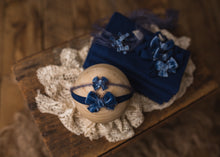 limited-edition choice of "Sapphire" petite or grande velvet bow OR "Blue" DreamSoft wrap ($20/22/15)