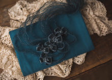 limited-edition teal velvet bows OR Teal DreamSoft wrap OR backdrop ($22/25/15/38)