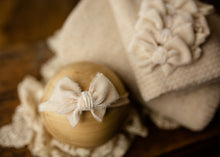 limited-edition "cream" grande bow headband OR "oatmeal" wrap OR backdrop ($22/16/42)